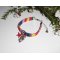 Pulseira de tecido colorido com borlas de golfinhos e estrelas-do-mar vermelhas